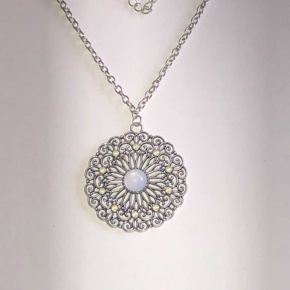 Silver Tone Filigree Sunburst Pendant Necklace with Opaque White Cabochon